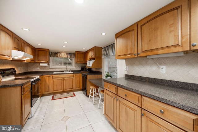 kitchen featuring decorative backsplash, black dishwasher, sink, light tile patterned flooring, and white electric range oven