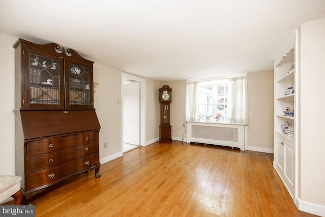 interior space featuring light hardwood / wood-style flooring and radiator heating unit