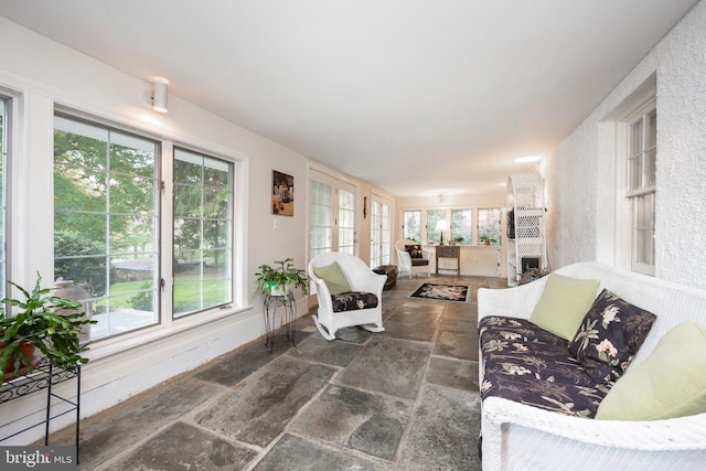 sunroom with a fireplace