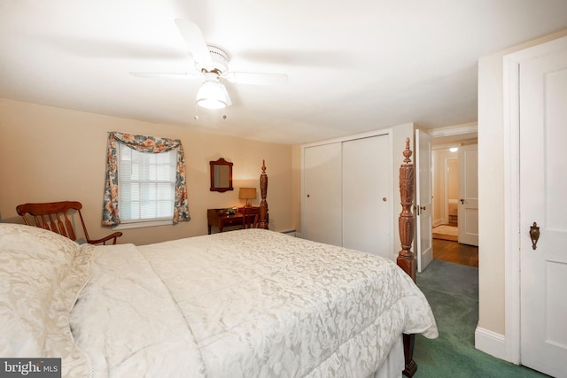 bedroom with dark carpet, a closet, and ceiling fan