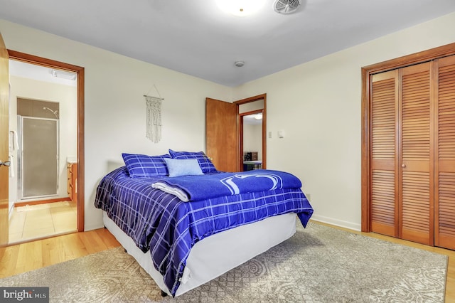 bedroom with a closet and wood-type flooring