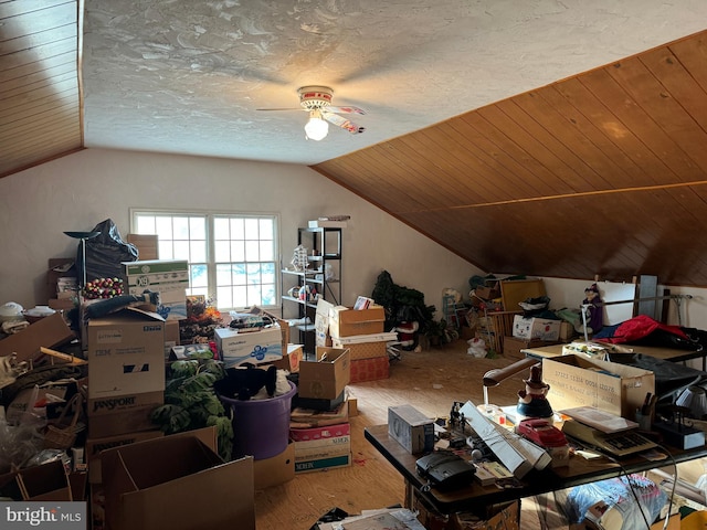 additional living space with hardwood / wood-style flooring, ceiling fan, a textured ceiling, and vaulted ceiling