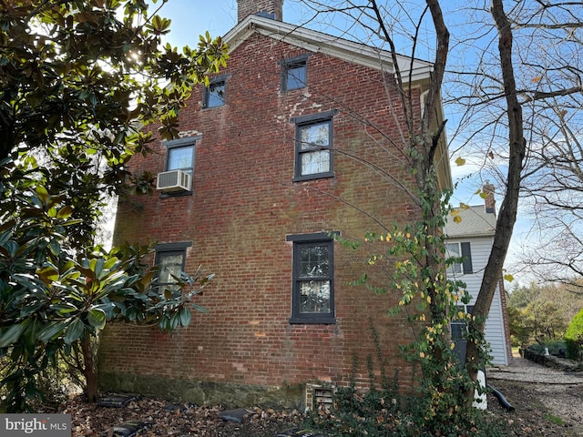 view of home's exterior featuring cooling unit