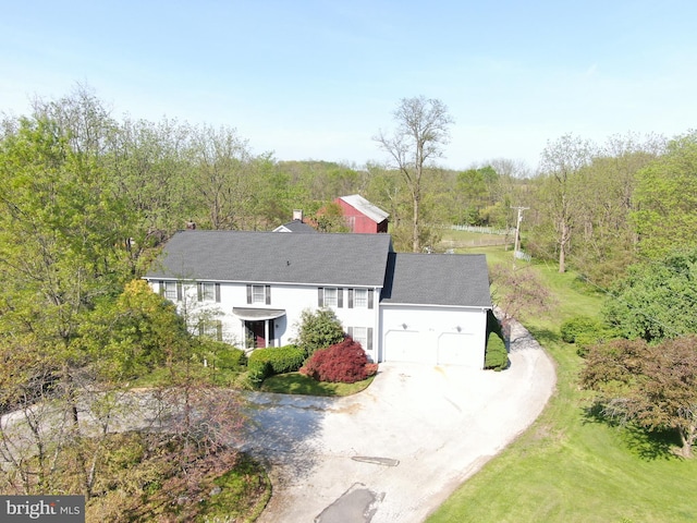 exterior space with a wooded view