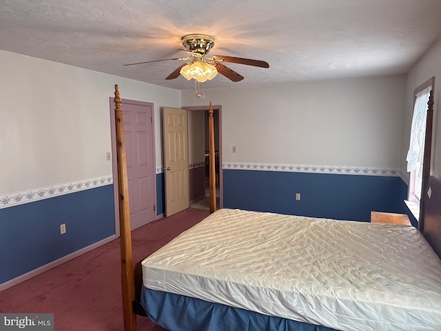 carpeted bedroom with baseboards and a ceiling fan