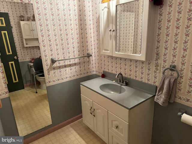 bathroom with vanity and toilet