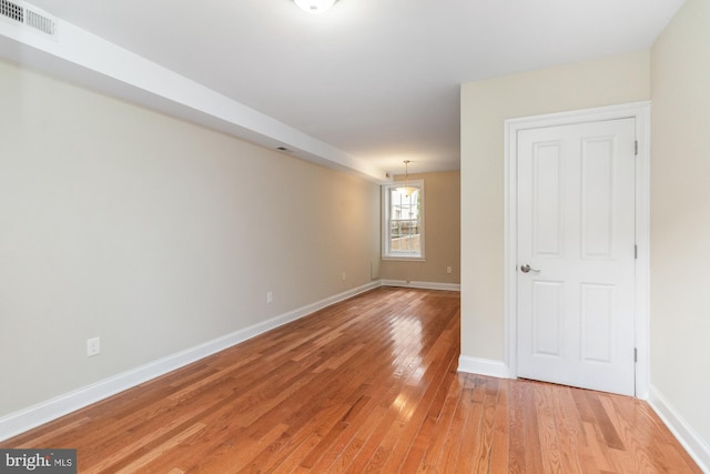 unfurnished room featuring light hardwood / wood-style floors