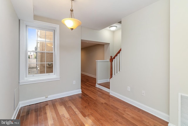 unfurnished dining area with hardwood / wood-style flooring