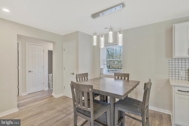 dining room featuring light hardwood / wood-style floors