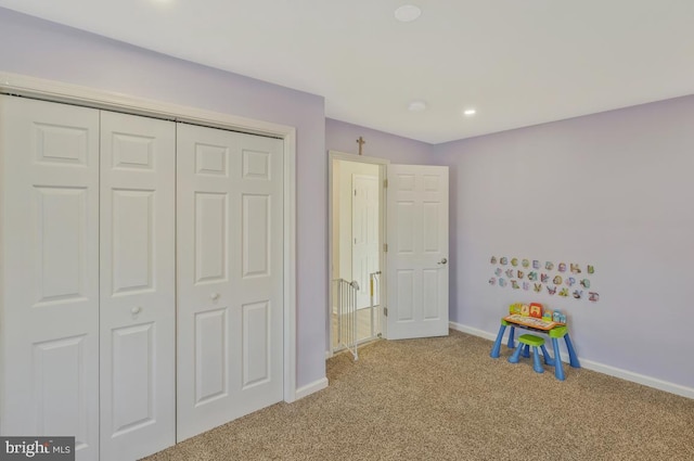 playroom featuring light carpet