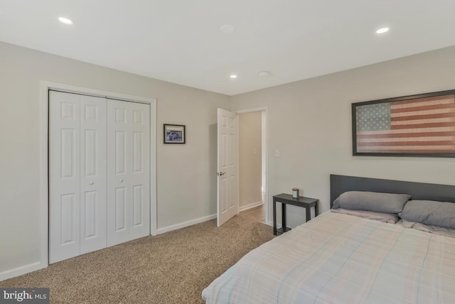 bedroom featuring a closet and carpet