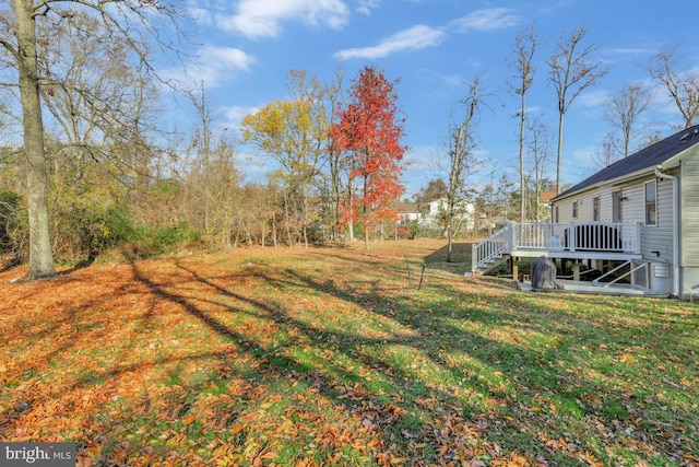 view of yard featuring a wooden deck