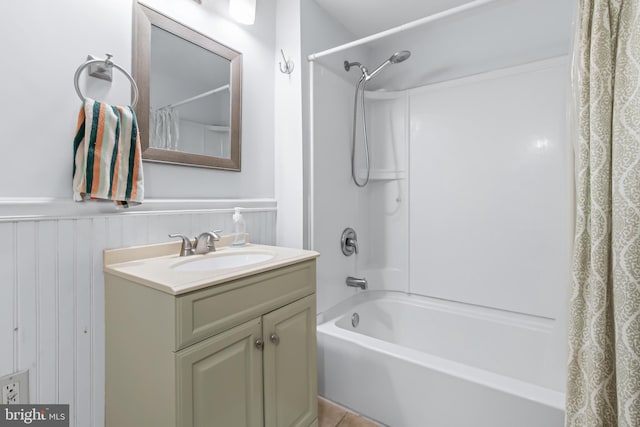 bathroom featuring shower / bath combo and vanity