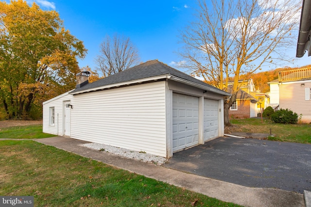 garage with a lawn