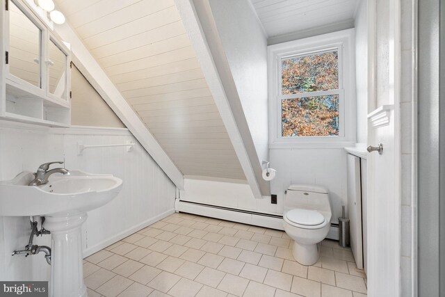 bathroom featuring a baseboard radiator, wood ceiling, toilet, and tile patterned flooring