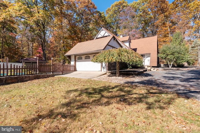 exterior space featuring a front yard and a garage