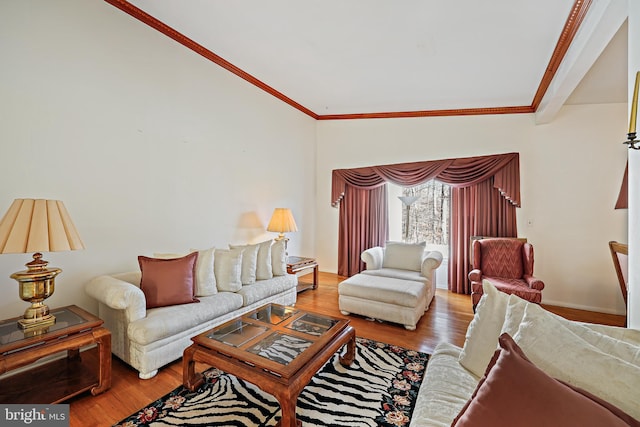 living room with wood-type flooring, vaulted ceiling, and ornamental molding