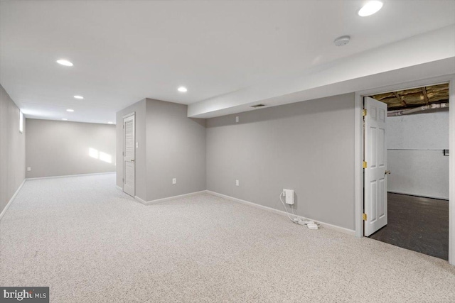 basement featuring dark carpet