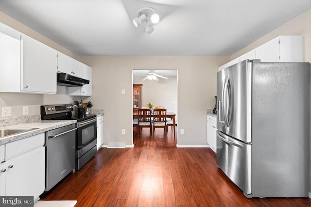 kitchen featuring ceiling fan, sink, dark wood-type flooring, white cabinets, and appliances with stainless steel finishes