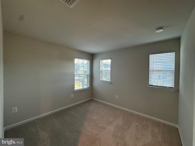 view of carpeted spare room