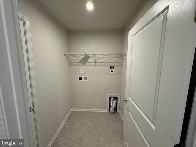 clothes washing area with hookup for a washing machine, light tile patterned flooring, and hookup for an electric dryer