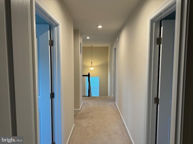 hallway with light carpet