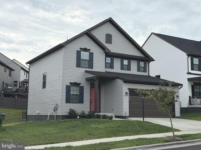 view of front facade with a front yard and a garage