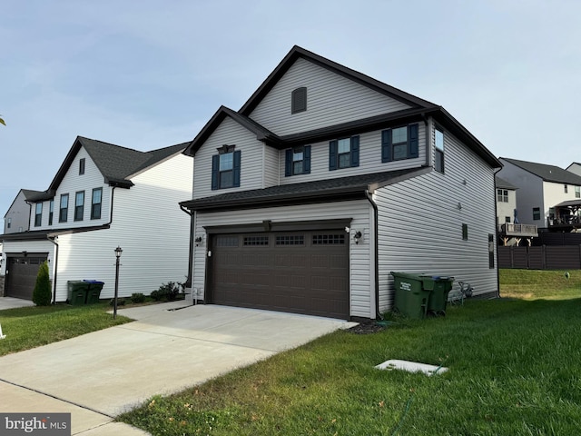 view of front facade featuring a garage and a front lawn