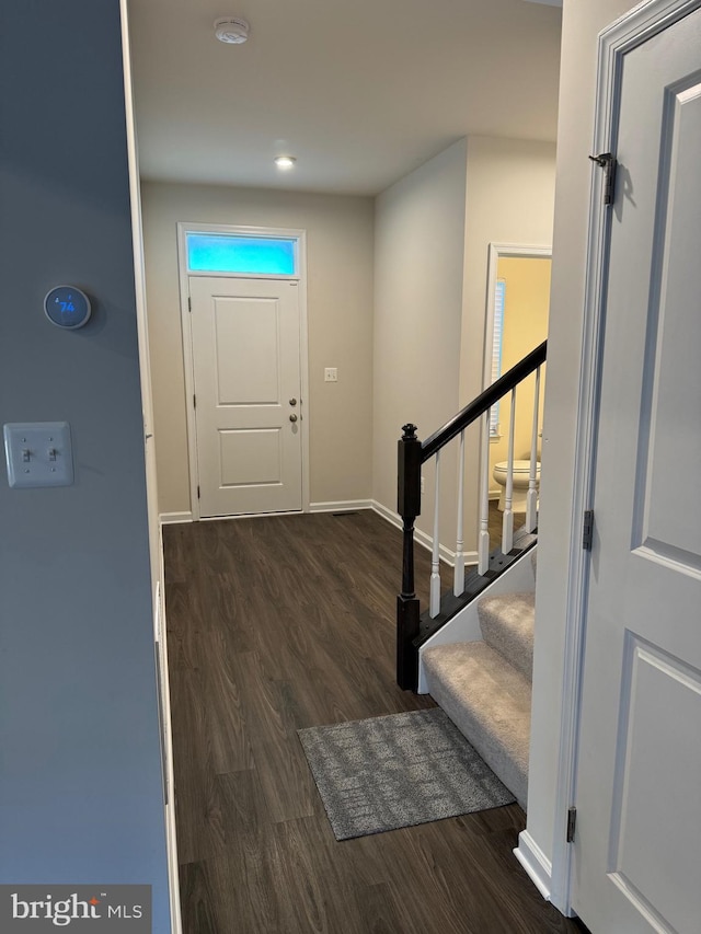 entrance foyer featuring dark wood-style floors, stairway, baseboards, and recessed lighting
