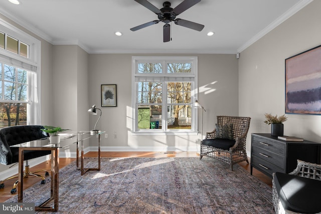 office space featuring ornamental molding, hardwood / wood-style flooring, and a healthy amount of sunlight