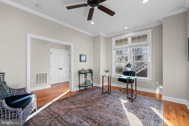 office space with ceiling fan, ornamental molding, and hardwood / wood-style flooring