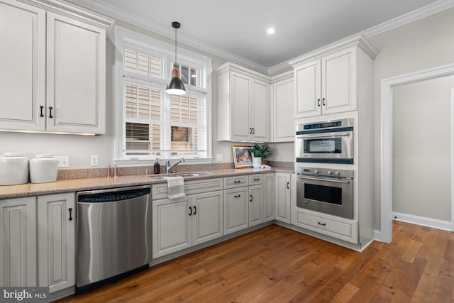 kitchen featuring white cabinets, stainless steel appliances, dark hardwood / wood-style floors, and sink