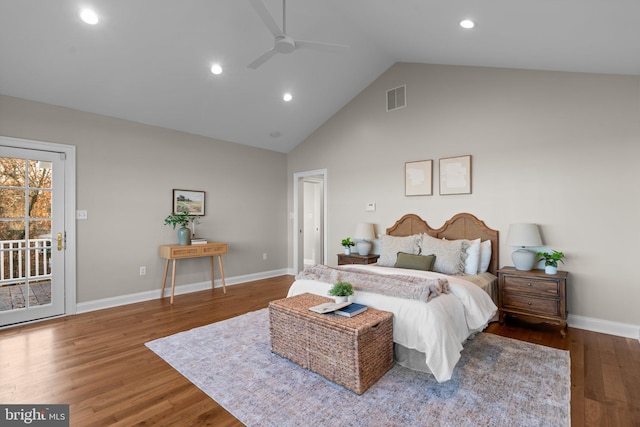 bedroom featuring hardwood / wood-style floors, ceiling fan, access to exterior, and high vaulted ceiling