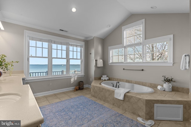 bathroom with tile patterned floors, a water view, crown molding, vaulted ceiling, and tiled tub