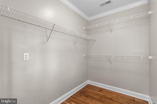 spacious closet featuring hardwood / wood-style flooring