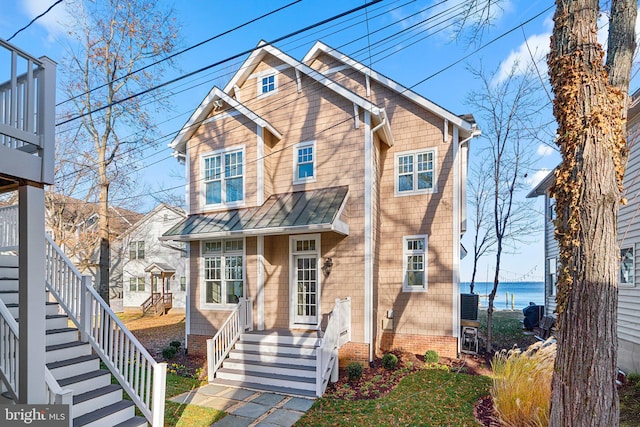 view of front of home featuring a water view