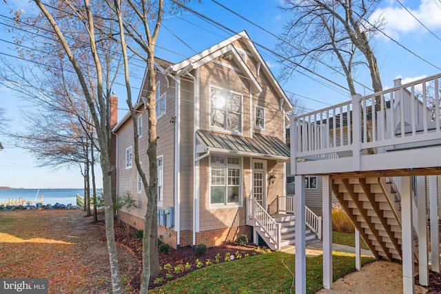 view of front of house featuring a water view