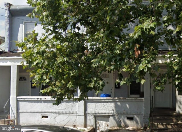 view of side of property with entry steps and crawl space