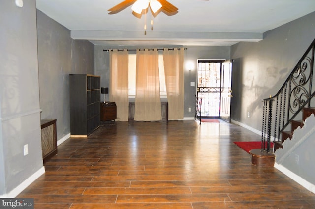 living room with ceiling fan and dark hardwood / wood-style flooring