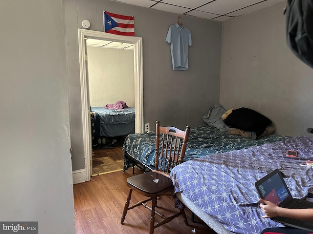 bedroom with hardwood / wood-style floors