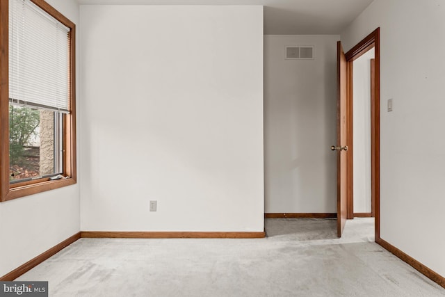 empty room with light colored carpet