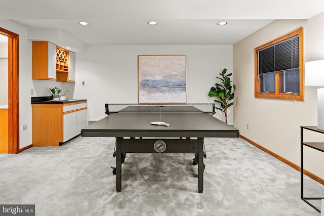 game room featuring light colored carpet