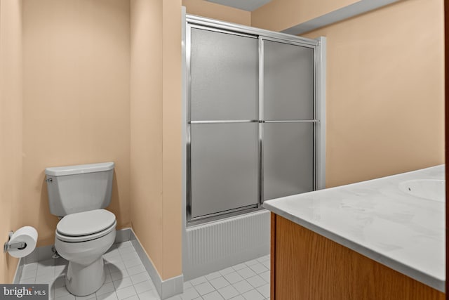 full bathroom featuring tile patterned flooring, vanity, toilet, and shower / bath combination with glass door