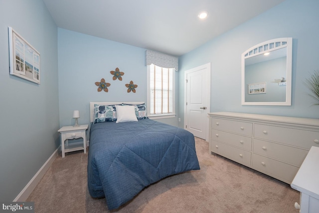 bedroom featuring light colored carpet