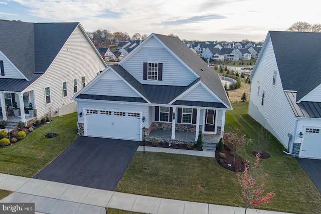 view of front of home with a front yard and a porch