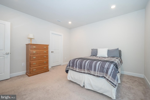 bedroom with light colored carpet