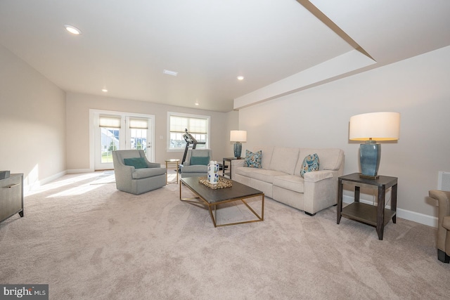 living room featuring light carpet