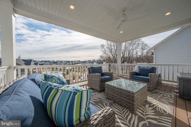 wooden deck with ceiling fan and an outdoor hangout area