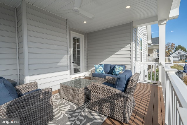 wooden terrace featuring ceiling fan