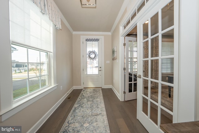 doorway with crown molding, french doors, and dark hardwood / wood-style floors